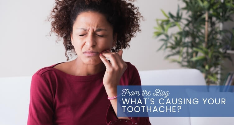 Woman holding her jaw in pain