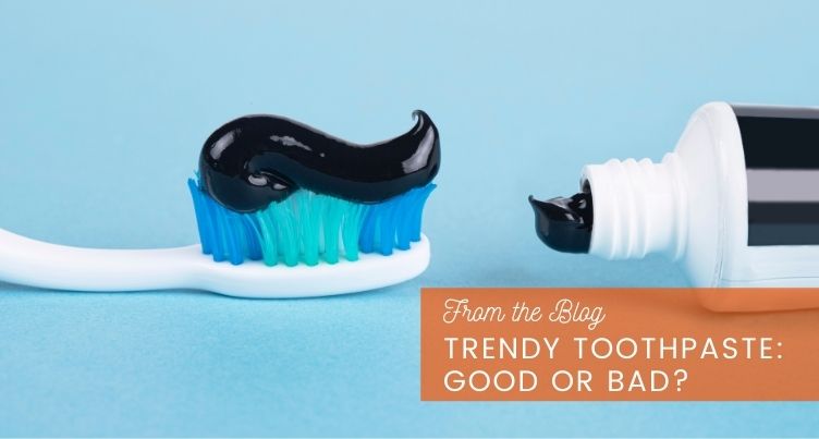 Charcoal toothpaste on a toothbrush