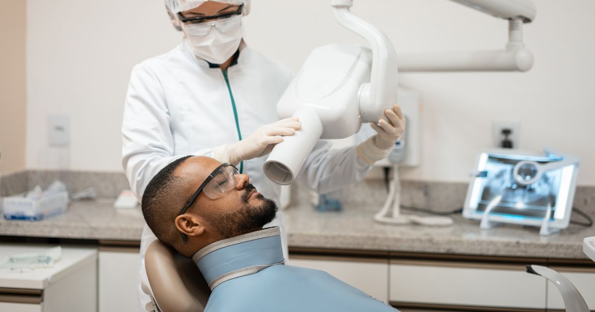 Patient having a dental X-ray taken