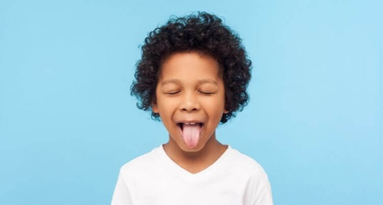 Child playfully sticking out their tongue