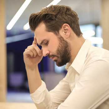 Person experiencing neck and shoulder pain