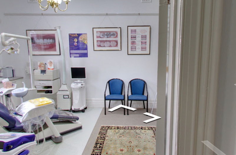 Consulting area with patient chairs and clinical wall charts