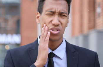 Man holding his jaw