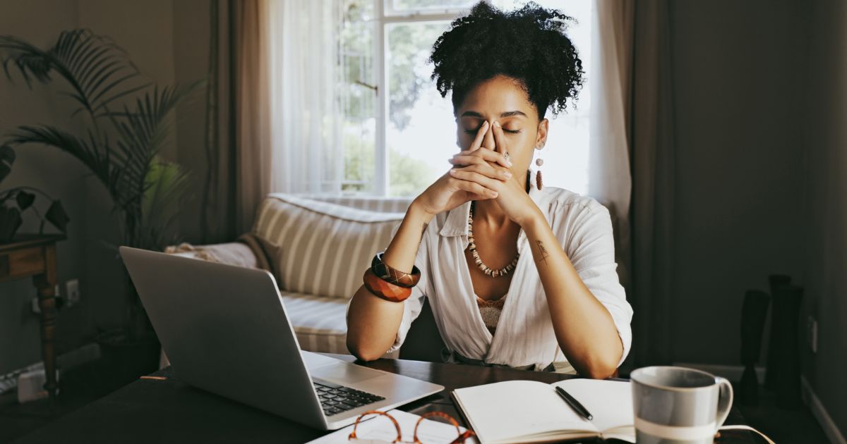 Stressed woman sitting at a desk