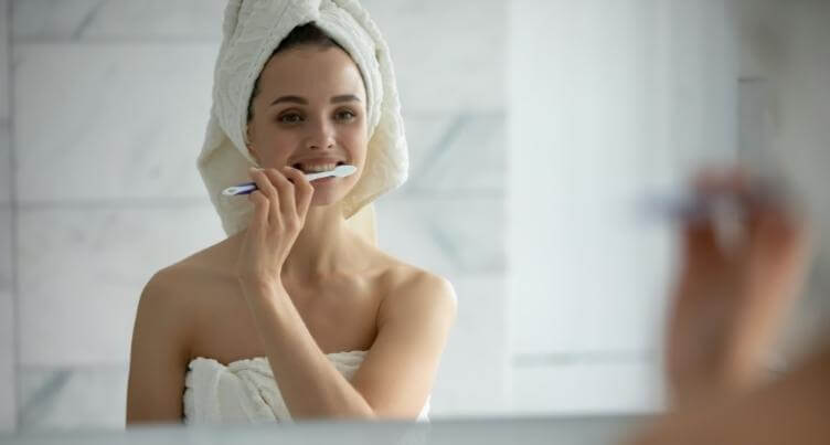 Woman brushing her teeth