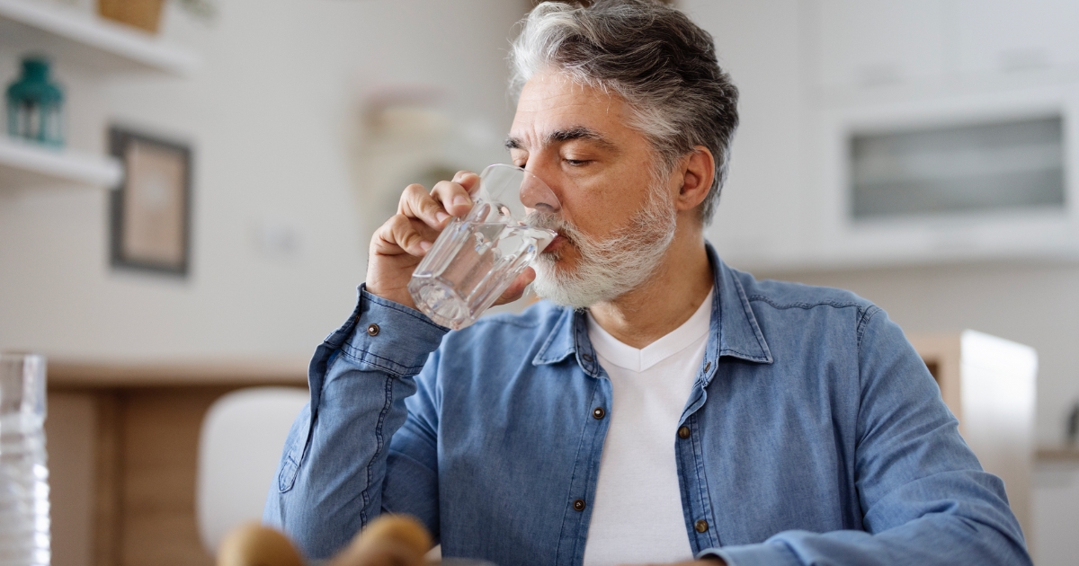 Man drinking a glass of water