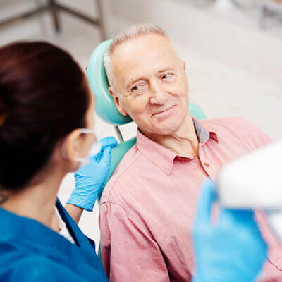 Patient discussing a custom oral appliance with a dental technician