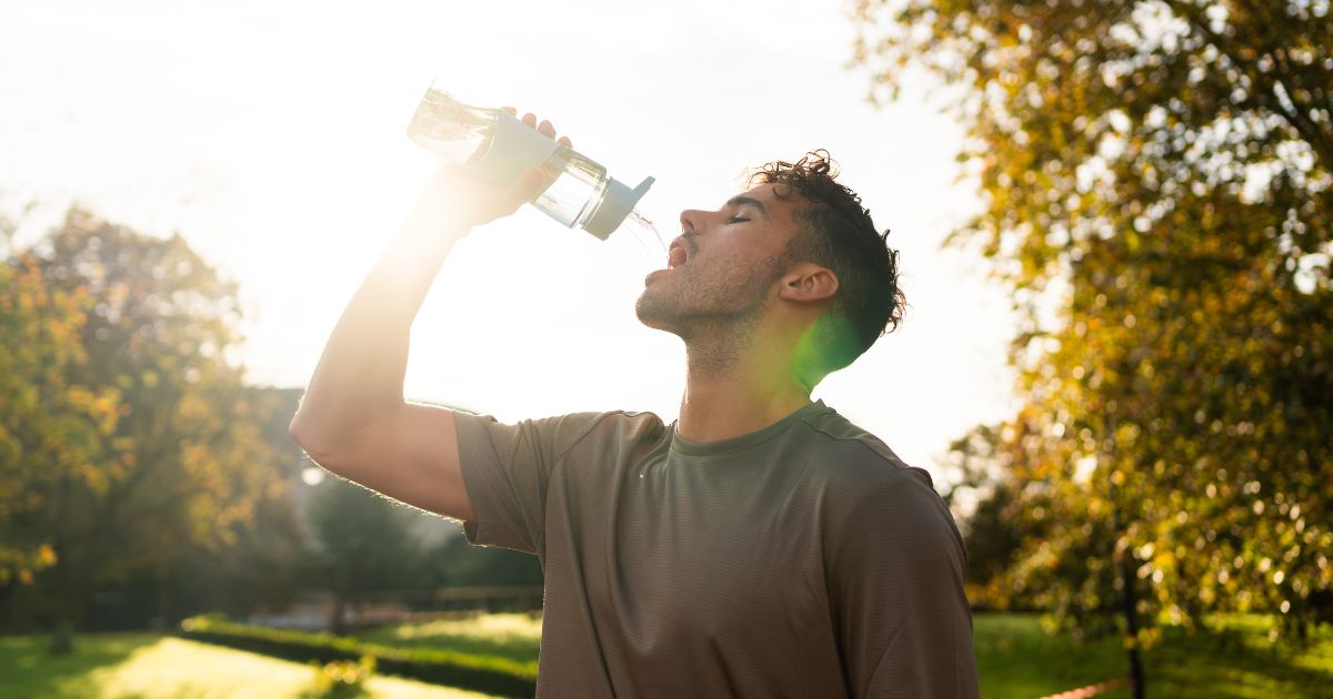Man drinking a glass of water