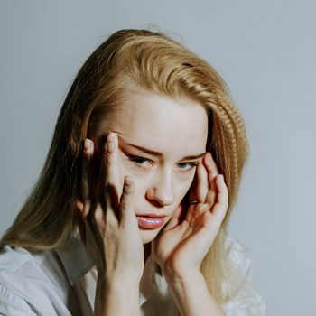 Woman experiencing a headache