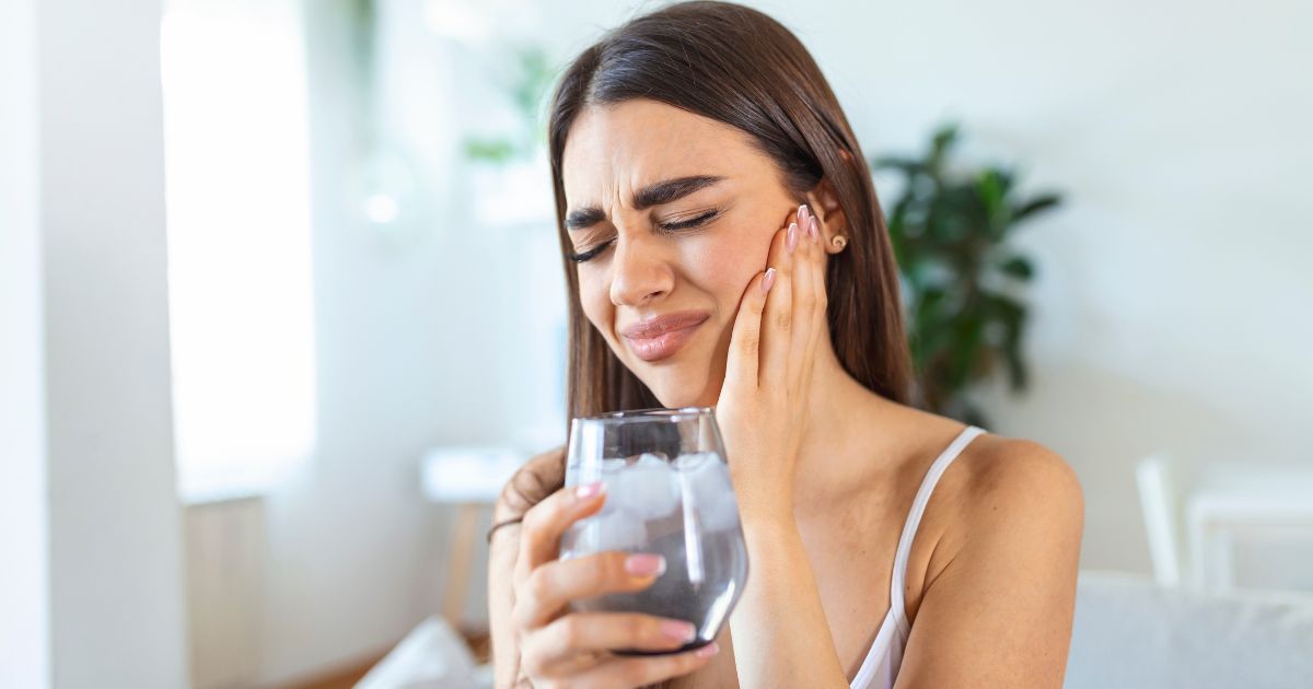 Woman drinking a glass of cold water