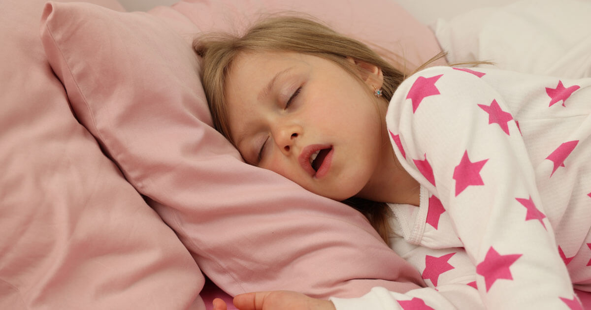 Young girl sleeping with her mouth open