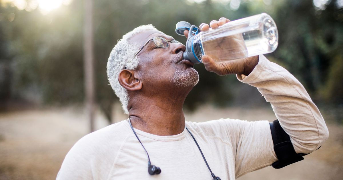 Man drinking a glass of water