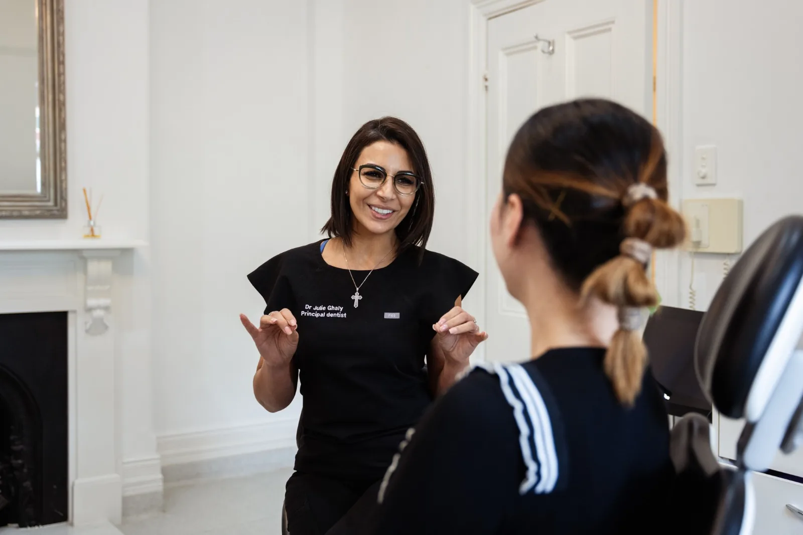 Dr Julie Ghaly discussing TMJ treatment options with a patient in the Toorak clinic